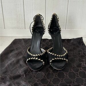 Beautiful black Gucci Black suede with gold tone leather trim heels. Size 5 1/2